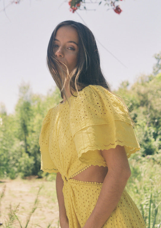 MAIA BERGMAN CARO DRESS The Caro dress is back and better than ever! Our most beloved style, this stunning dress features puff sleeves, waist cut-outs, and a laced open back. Made in cotton eyelet, the Caro dress is sophisticated, modern, and romantic, all rolled into one. Perfect for summer events and beyond, this dress is truly a hero.