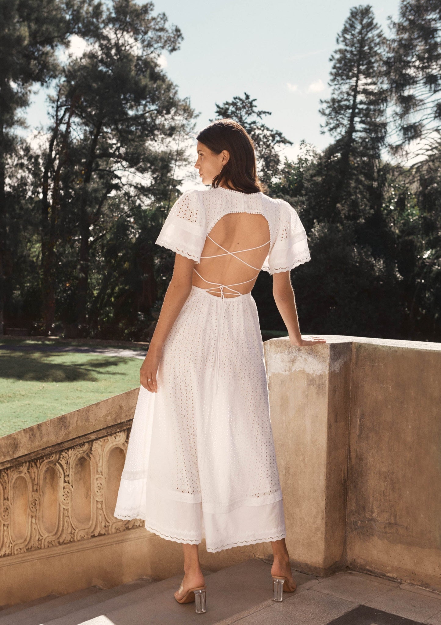 MAIA BERGMAN The Caro dress is back and better than ever! Our most beloved style, this stunning dress features puff sleeves, waist cut-outs, and a laced open back. Made in cotton eyelet, the Caro dress is sophisticated, modern, and romantic, all rolled into one. Perfect for summer events and beyond, this dress is truly a hero.