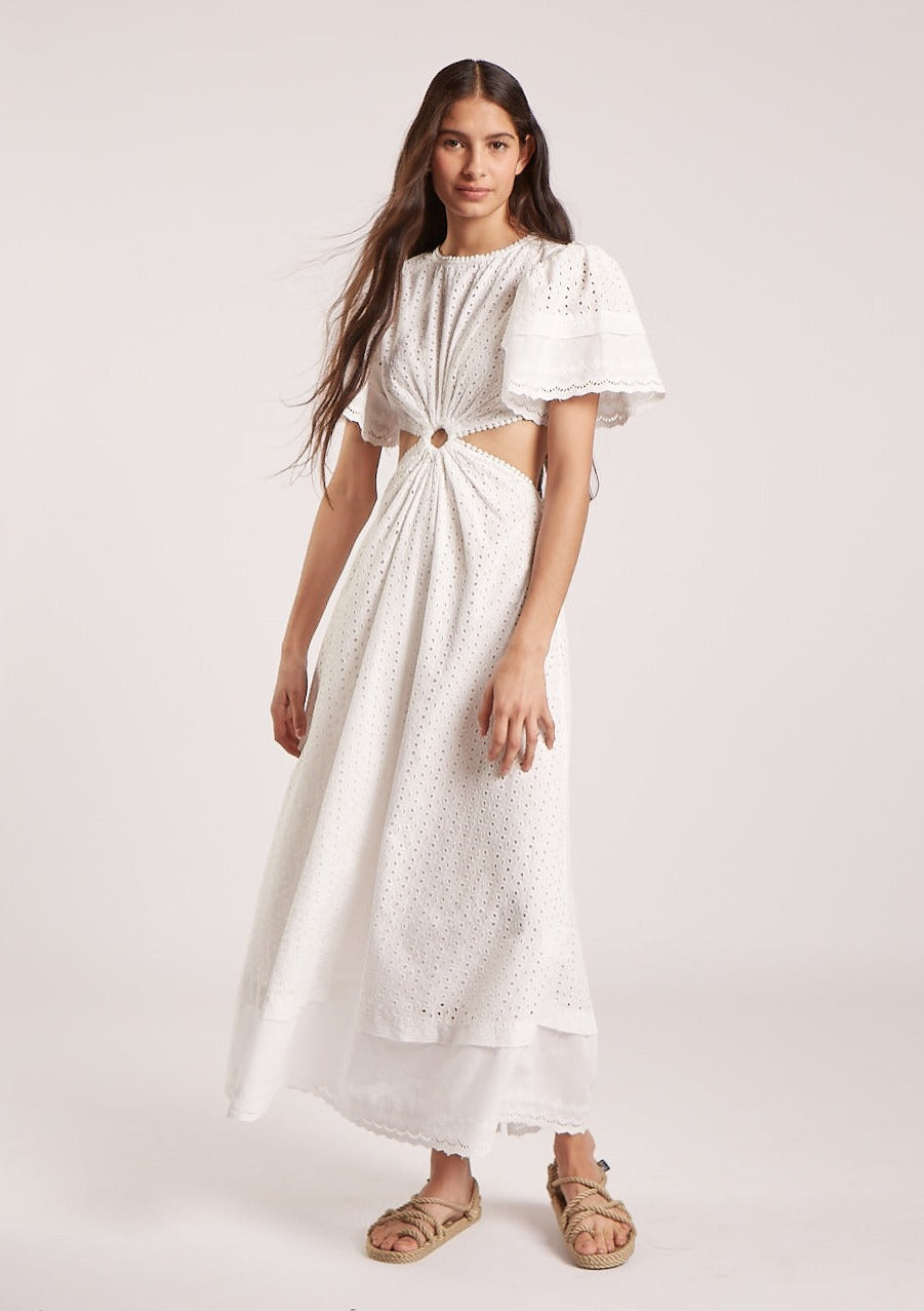 MAIA BERGMAN The Caro dress is back and better than ever! Our most beloved style, this stunning dress features puff sleeves, waist cut-outs, and a laced open back. Made in cotton eyelet, the Caro dress is sophisticated, modern, and romantic, all rolled into one. Perfect for summer events and beyond, this dress is truly a hero.