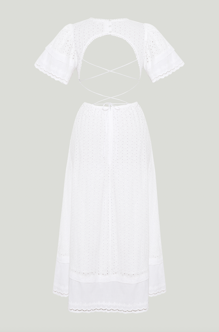 MAIA BERGMAN The Caro dress is back and better than ever! Our most beloved style, this stunning dress features puff sleeves, waist cut-outs, and a laced open back. Made in cotton eyelet, the Caro dress is sophisticated, modern, and romantic, all rolled into one. Perfect for summer events and beyond, this dress is truly a hero.